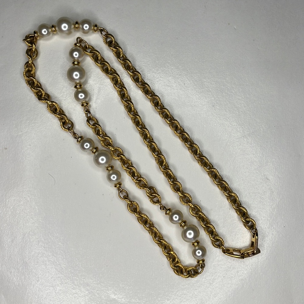 Napier single strand gold tone chain with faux pearls.